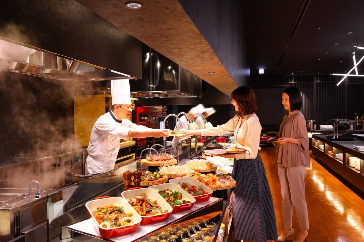GROTTO's chefs at work preparing and serving dishes