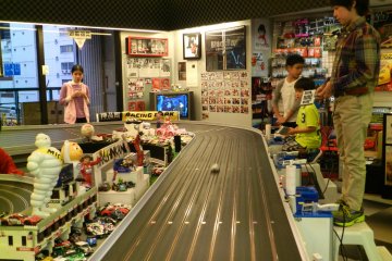 <p>There is a racetrack where kids can race cars.</p>