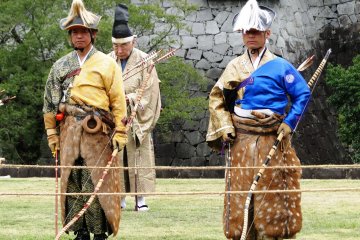 Archers are introduced at an opening ceremony