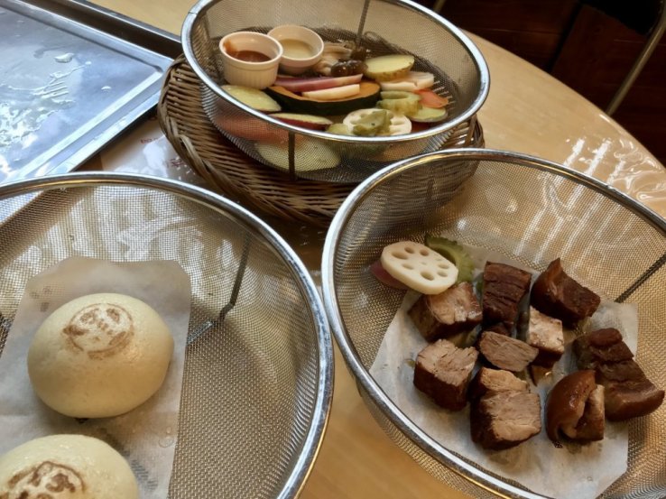 Steamed buns, veggies, and meat at Jigoku Mushi Kobo Kannawa