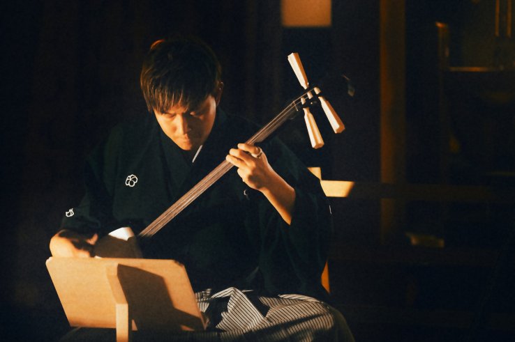 Playing a shamisen