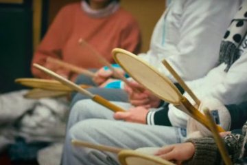 Audience playing music during Soil & 5 Grains