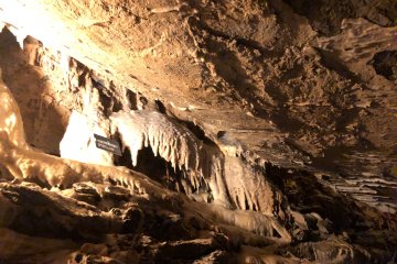 Stalactite crystals are lit to show visitors their unique shape and structure