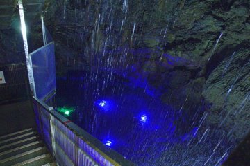 Stairway along the pool of the 30m underground waterfall