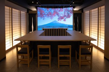 Indoors with a very large screen