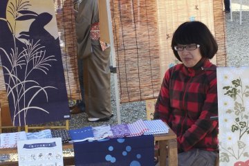 Vendor selling traditional "Tenugui"
