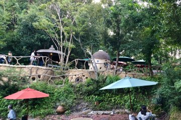 Outdoor seating area among the little cottage dwellings