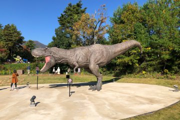 The Tyrannosaurus Monument, right by a big park with dinosaur-themed playground equipment!