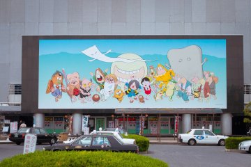 The massive art piece that decorates the wall of the Ferry terminal directly by the station.