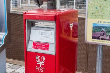Even the post box has its own guardian spirit.
