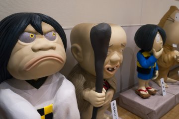 Colourful statues of the anime characters stand in the nearby museum