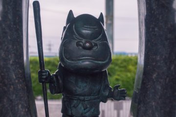 Creative and intricate bronze statues of the anime characters litter the street and area around the station.