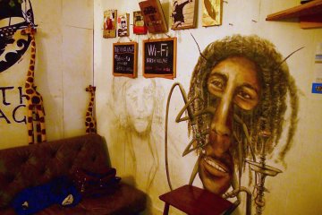 <p>Kafka-esque cockroach-man mural. Free Wi-Fi is available at North Village.</p>