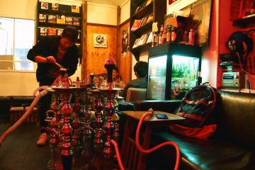 <p>The staff using a vacuum to set up the shisha. Trust the Japanese to find the most efficient way to do things!</p>