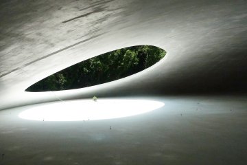 The uniquely designed Teshima Art Museum fuses art, architecture, and the natural environment