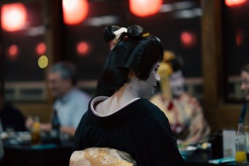 Eitaro enjoying a conversation with guests