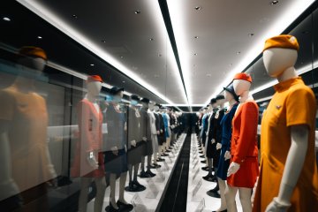 Past uniforms on display at the JAL SKY MUSEUM