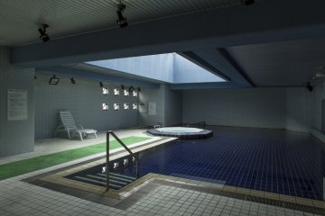 This indoor pool is filled with naturally heated spring water at Hotel Ravie Kawaryo near Ito Station