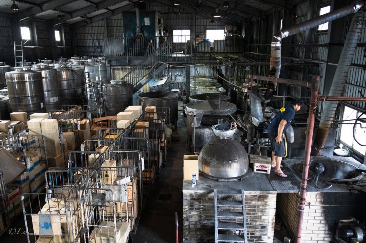 One of Mr. Sakimoto’s sons works at the factory checking one of the important processes to make Awamori sake.