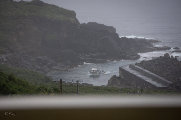 A boat enters a Yonaguni port.