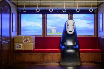 No Face riding the train from the bathhouse