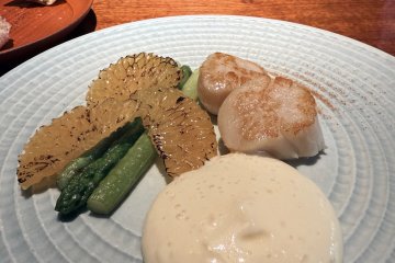 DInner fare consists of local seafood and vegetables