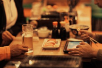 People eating at an izakaya