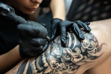 A tattoo artist at work