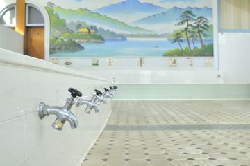 The washing section to the side of a public bath