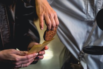 Pumpkin-flavored, cookie-type senbei fresh off the mold