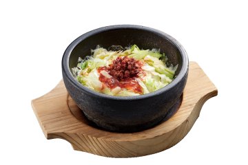 Stone-grilled taco rice served in a hot stone bowl (649 JPY including tax), combining seasoned meat and rice with crispy edges