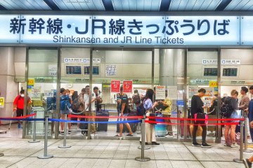 People getting tickets for the bullet train