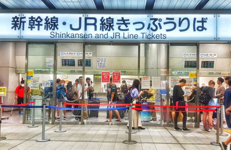 People getting tickets for the bullet train