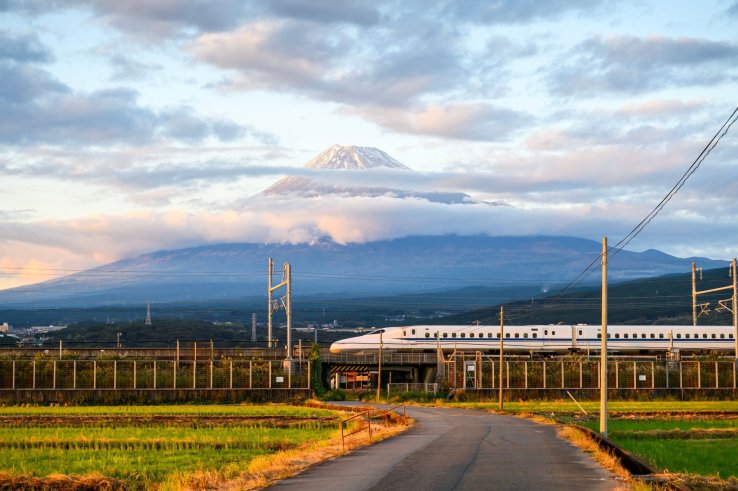 A Japanese bullet train passing by Mt. Fuji