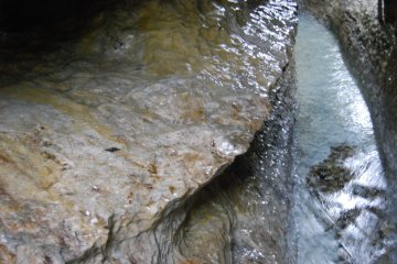 Fresh water gulley that winds its way gracefully through Rokando cave.