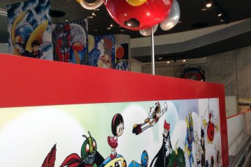 A picture of nearly a dozen manga characters teases you as you make your way upstairs. Just a little further and you can see all the awesome exhibits.