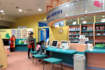 Across from the third floor café is the reading library. Enjoy...I mean reserach!... all the comic books you want for as long as you want. Entrance is free with paid admission.