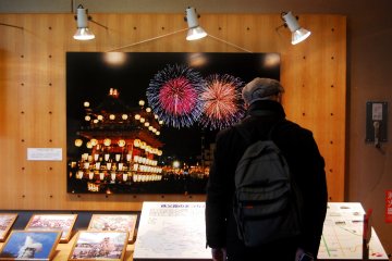 A visitor took a look on photo exhibition