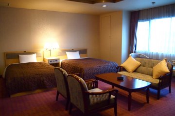 The largest room, Twin Deluxe B is very spacious, furnished with sofas and a large bathroom.