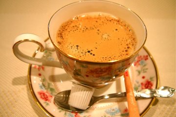 A beautiful cup of coffee to end off a scrumptious meal.