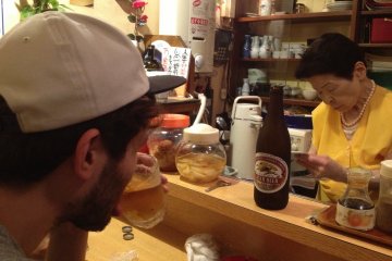 My brother across from the wonderful old lady who served us