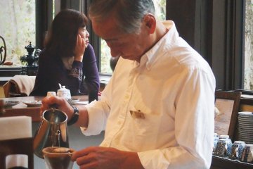 The barista will then gently pour scalding water over the grounded coffee powder to create a delicious drip coffee.