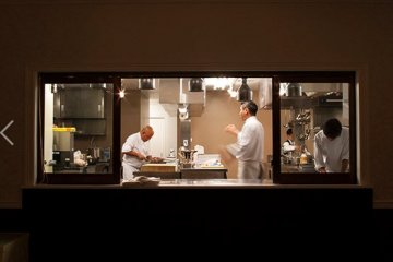 Chef Masa carefully directs the kitchen staff