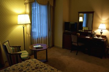 The seating area with an elegant wooden desk