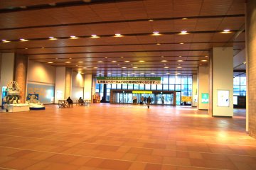 <p>The station is spacious with warm lighting.</p>