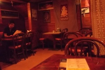 <p>There's lots of wood, and colorful prints and hangings</p>