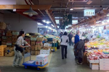 Action at the greengrocer stalls  at Akita Citizens market one of the freshest fish markets north of Tsukiji