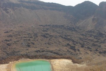 Crater lake filled with waters of a strangely metalic color