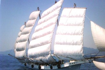 <p>The Kumamoto Utase historical boat in full sail off the Amakusa Islands</p>