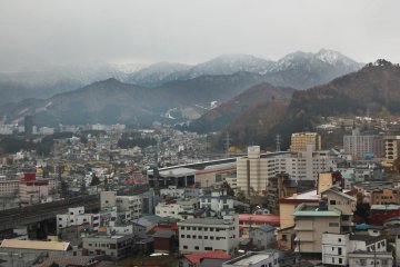 <p>Yuzawa&nbsp;Town from above, covered by snowy mountains</p>